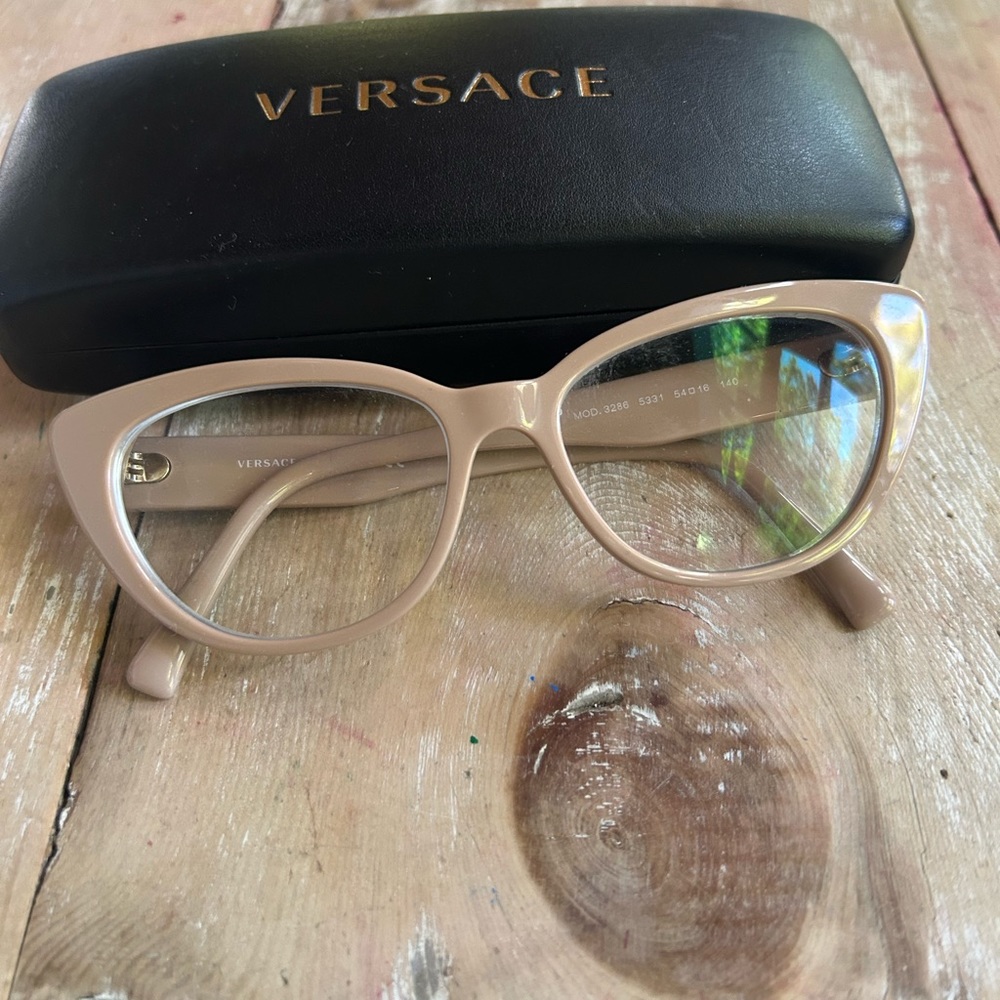Neutral Versace cat eye glasses, barely worn. I do not have the original lenses